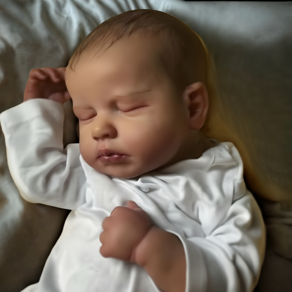 Daniel Reborn Doll on a simple blanket background