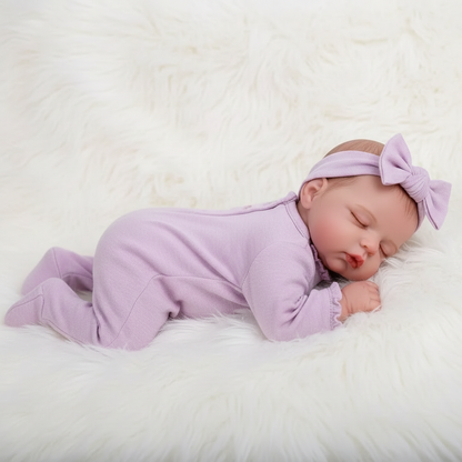 Kamil in pink romper